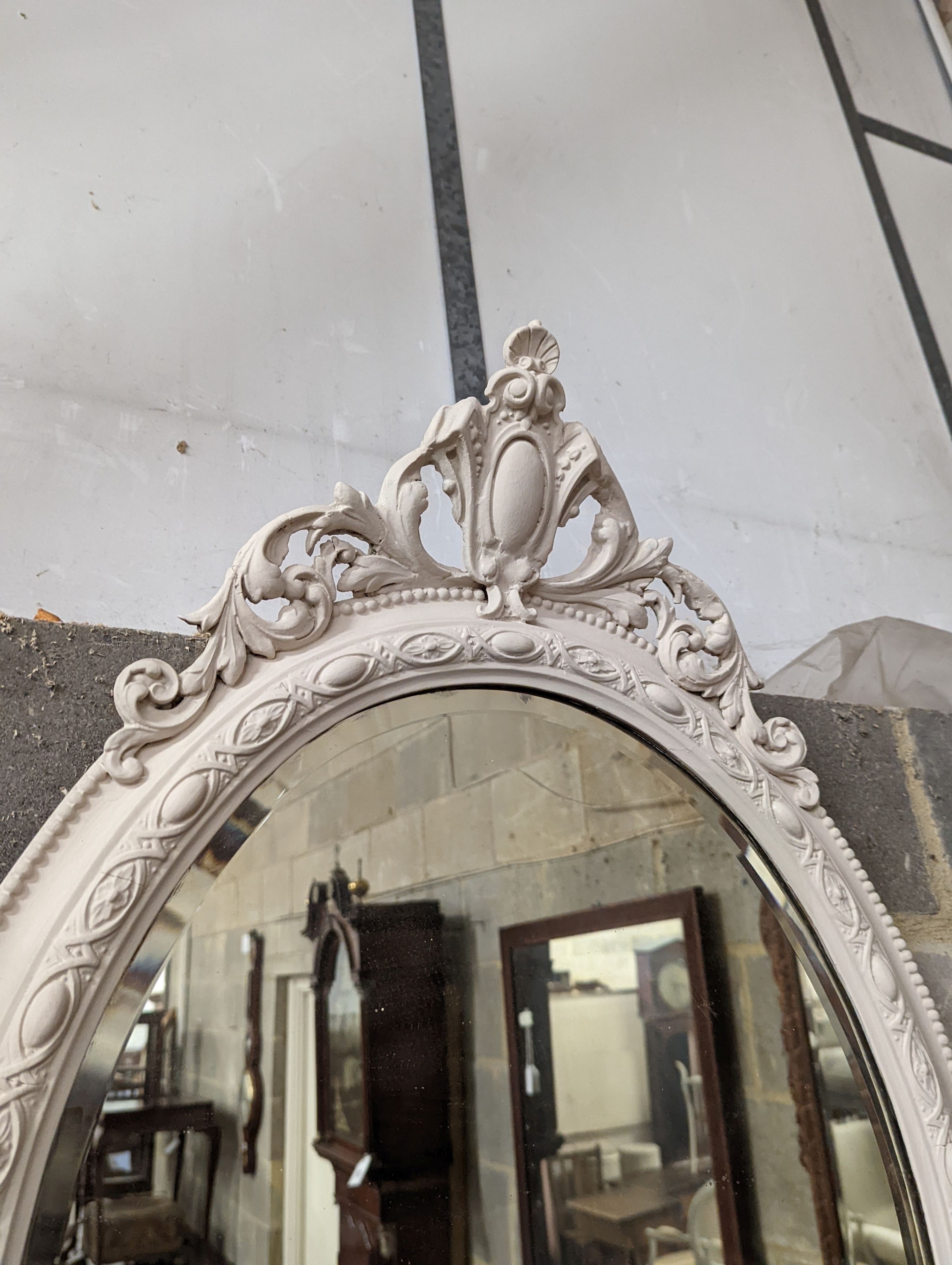 A Victorian later white painted oval gilt wood and gesso girandole, width 56cm, height 92cm